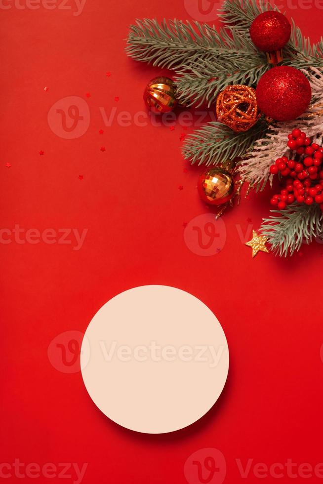 Mock up podium or pedestal for skincare beauty products and Christmas decorations top view on red background photo