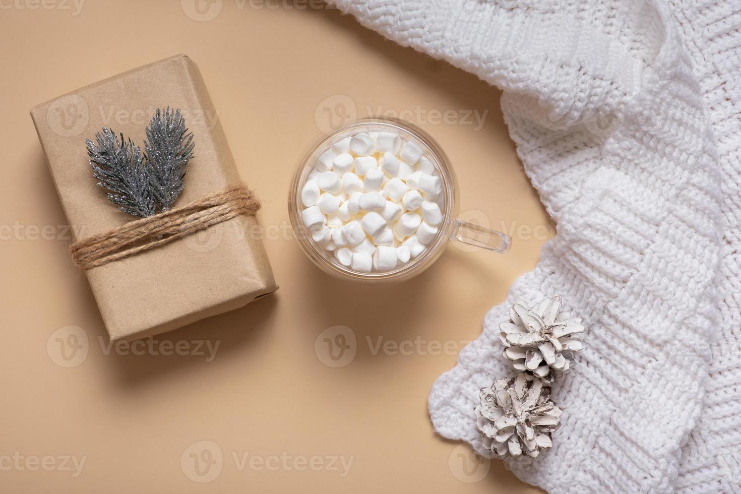 Christmas hygge flat lay composition with present, plaid and marsh mellow top view. Christmas magic time concept photo