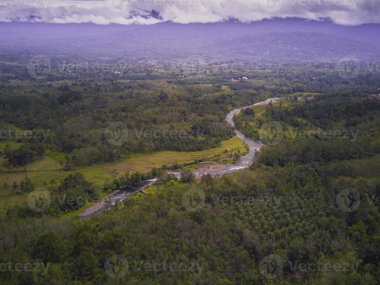 aerial view of river and mountain on sunny morning photo