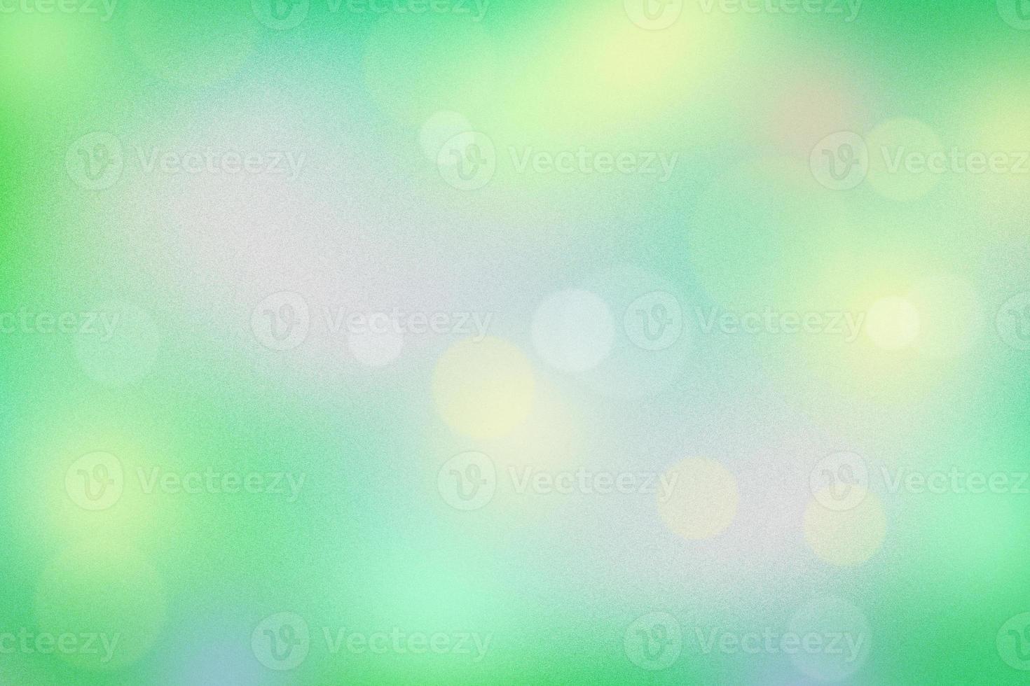 green grainy abstract background with bokeh and blur effect photo