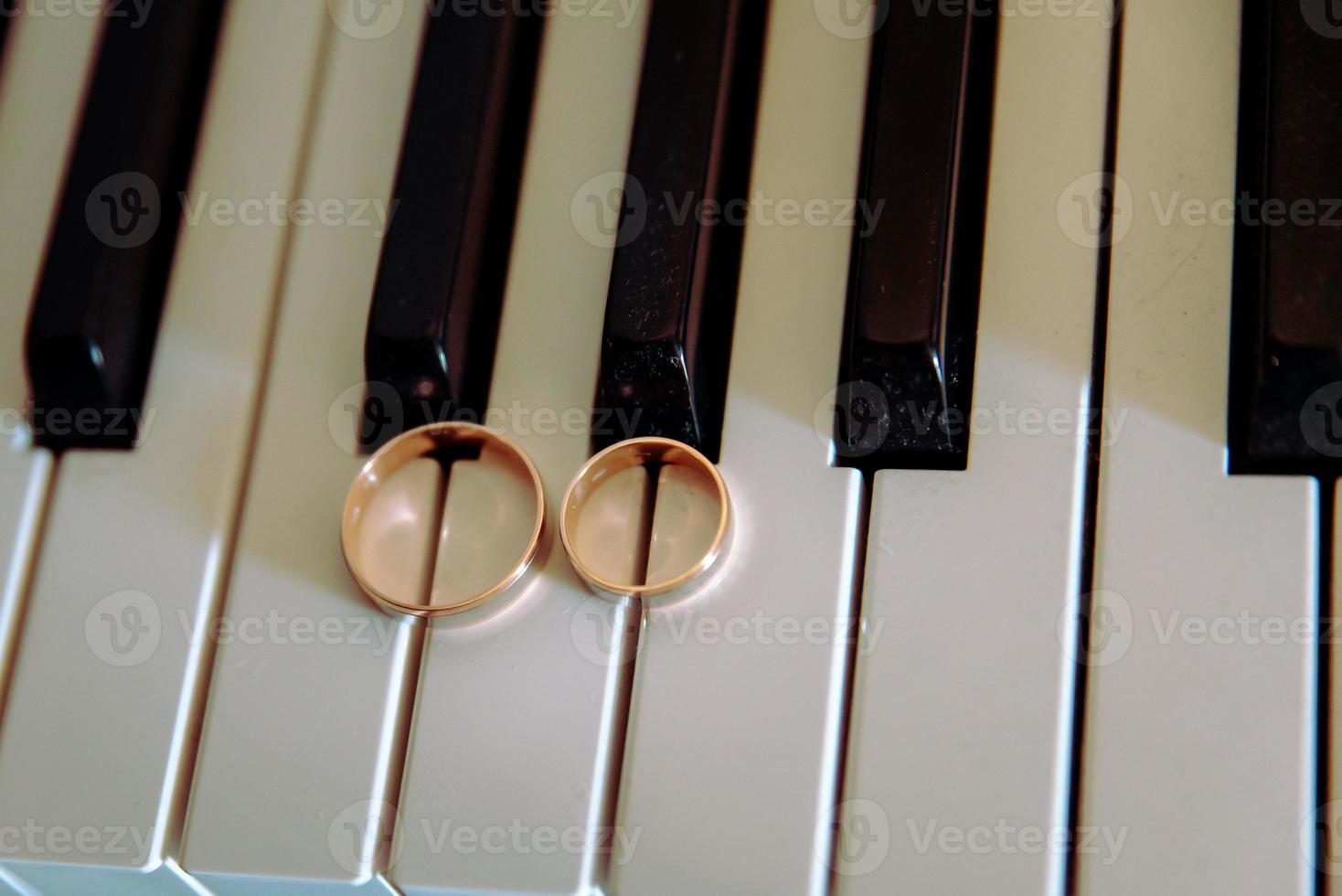 Two wedding rings on the floor with contrast photo