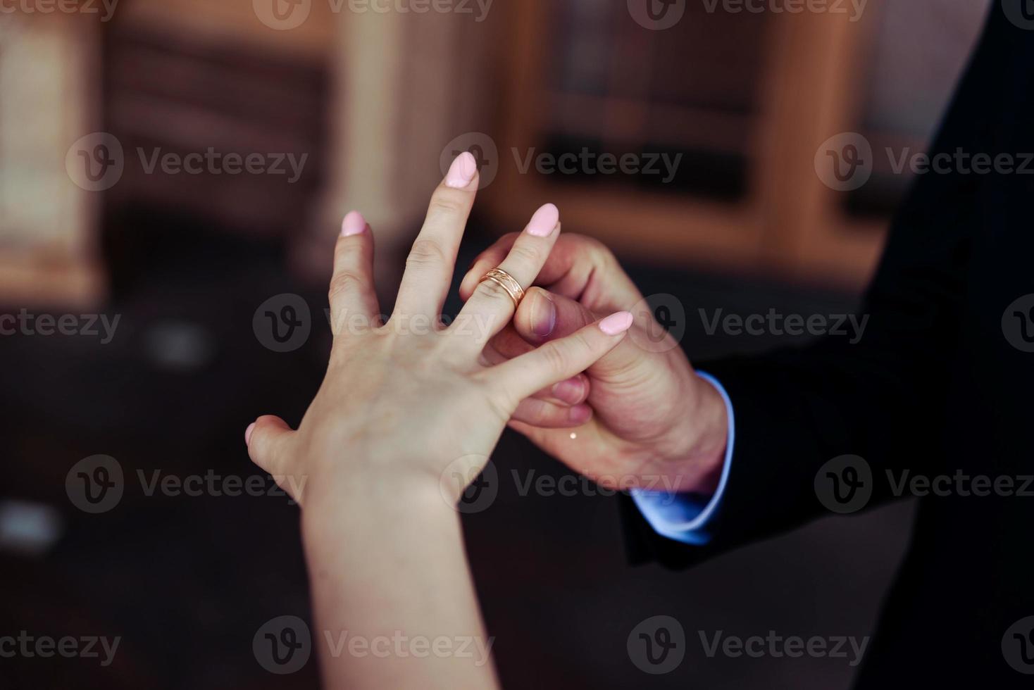 Bride and groom exchange rings at the wedding. photo