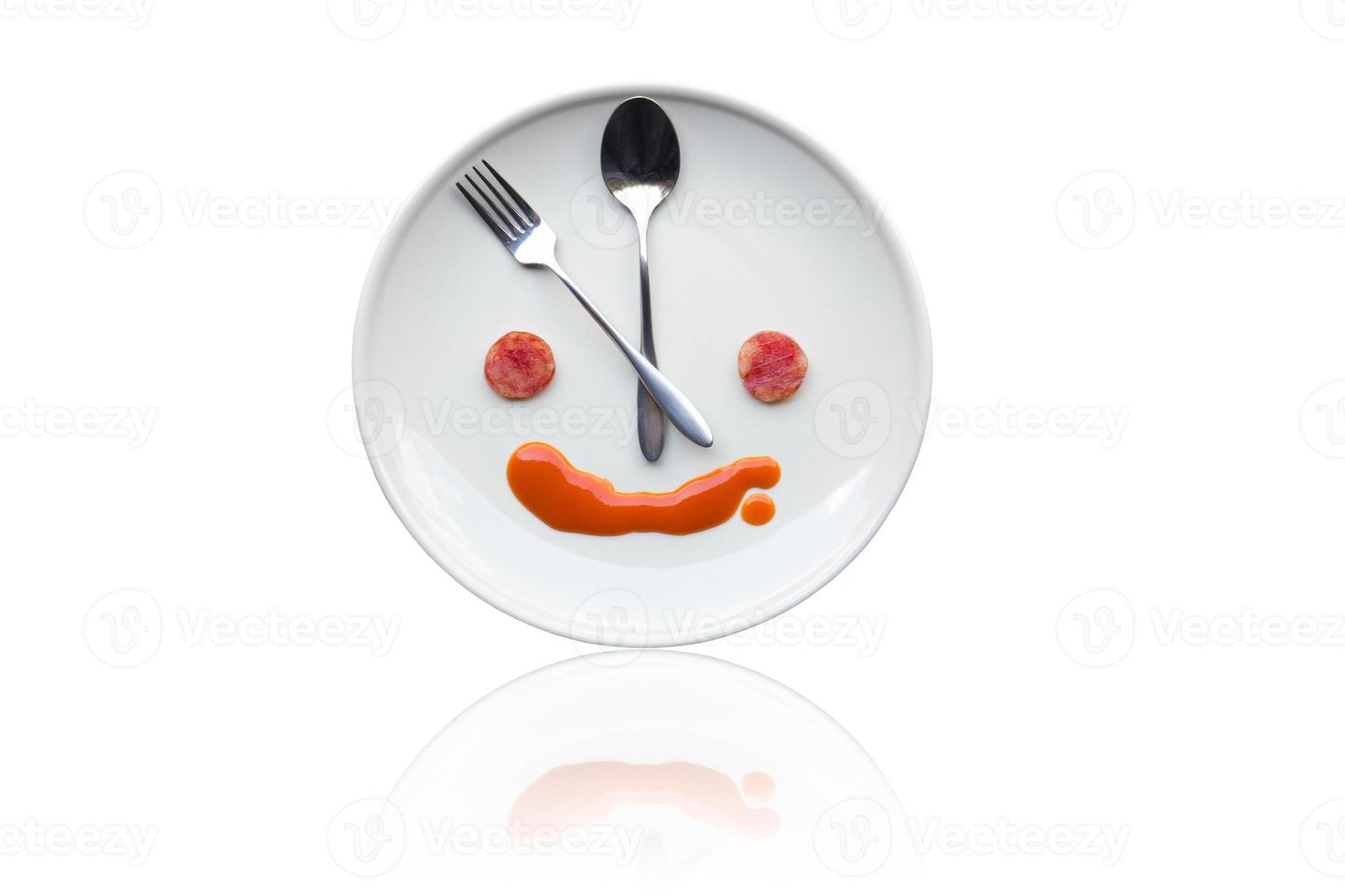 Metal spoon and fork arrange as clock face photo