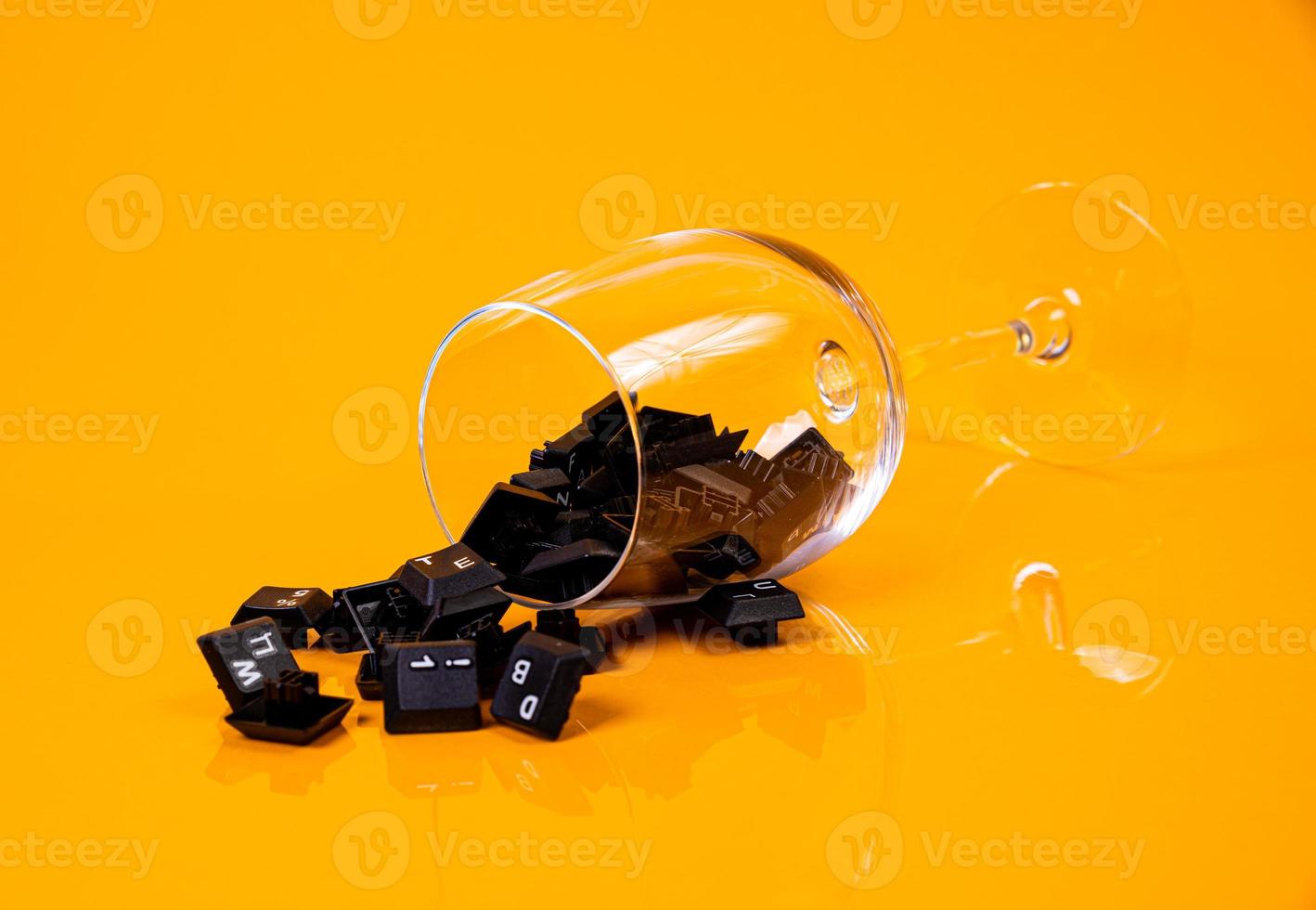 keyboard button in glass in jar in bucket on orange background photo