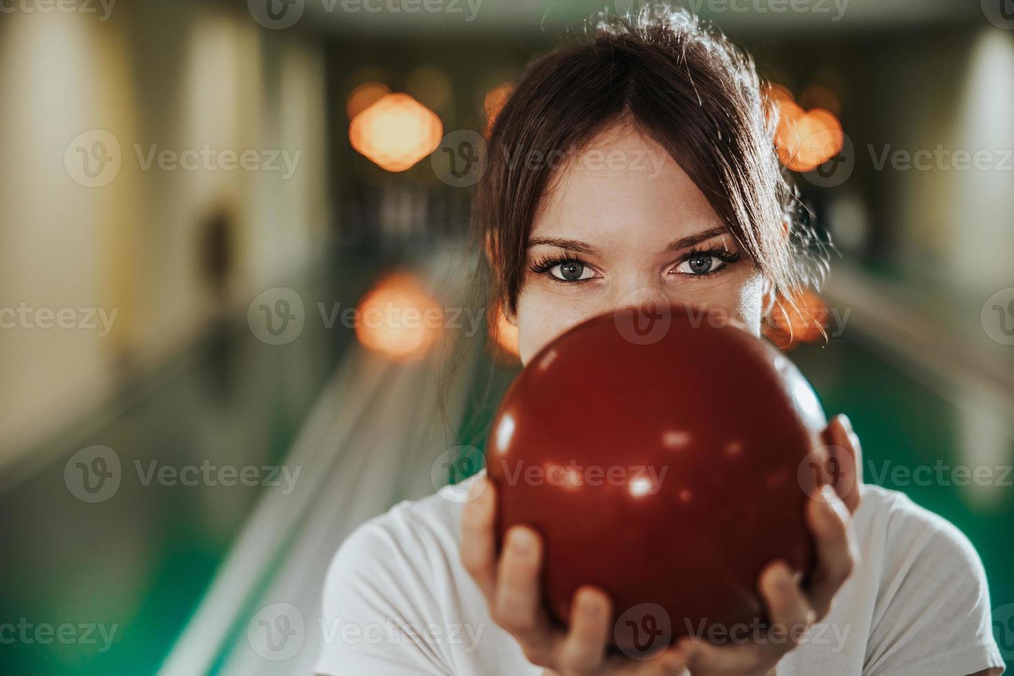 Young Woman Having Fun In A Bowling Alley photo