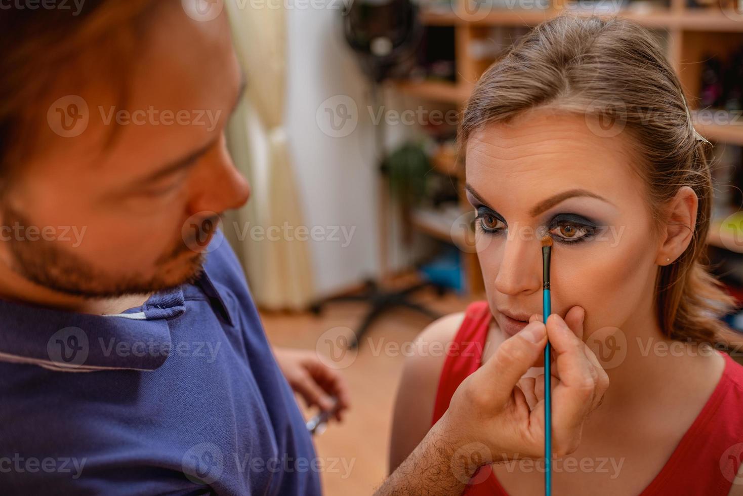 Applying makeup view photo