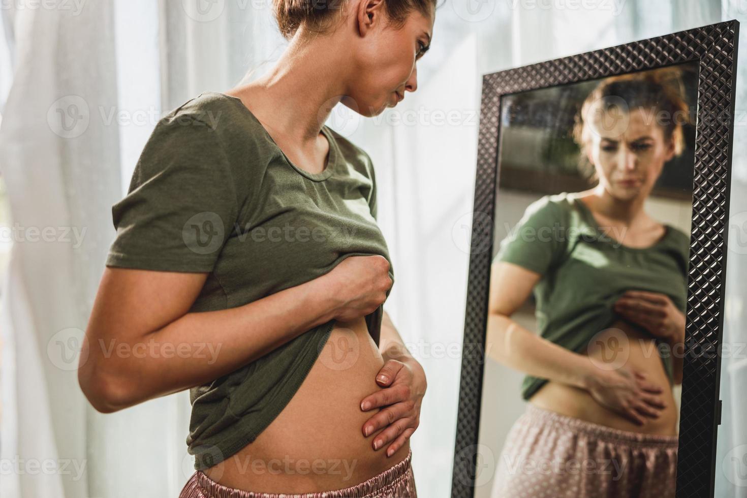Woman Suffering From Stomach Cramps photo