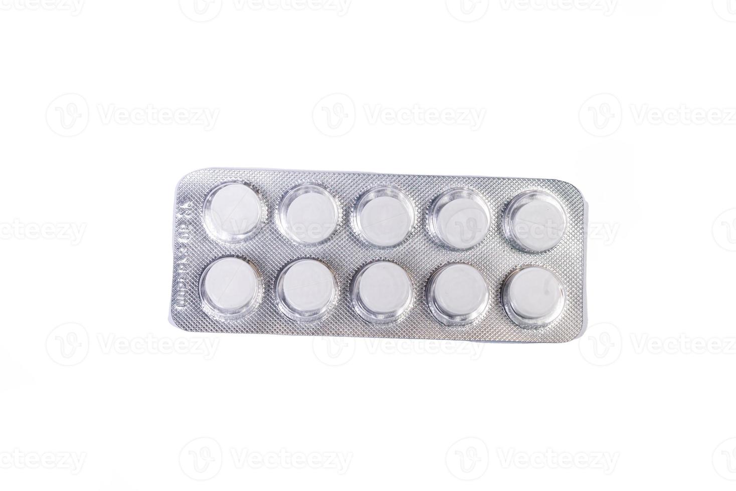 Medical pill blister on isolated white background with reflection photo