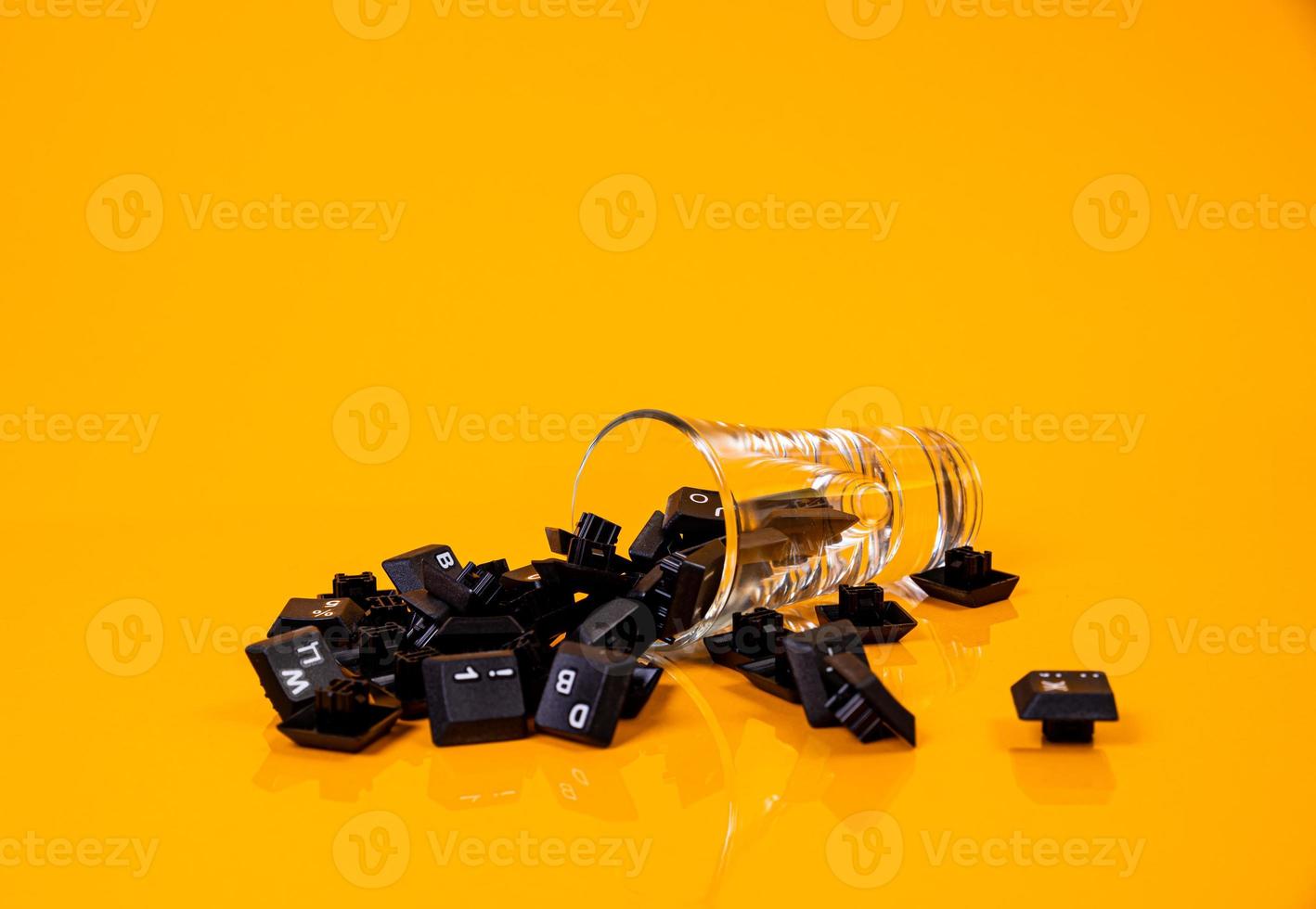keyboard button in glass in jar in bucket on orange background photo