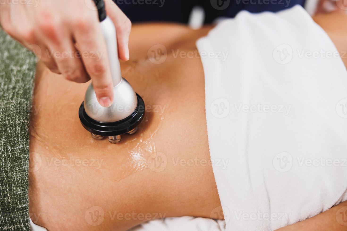 Woman Enjoying Anti Cellulite RF Lifting Treatment photo