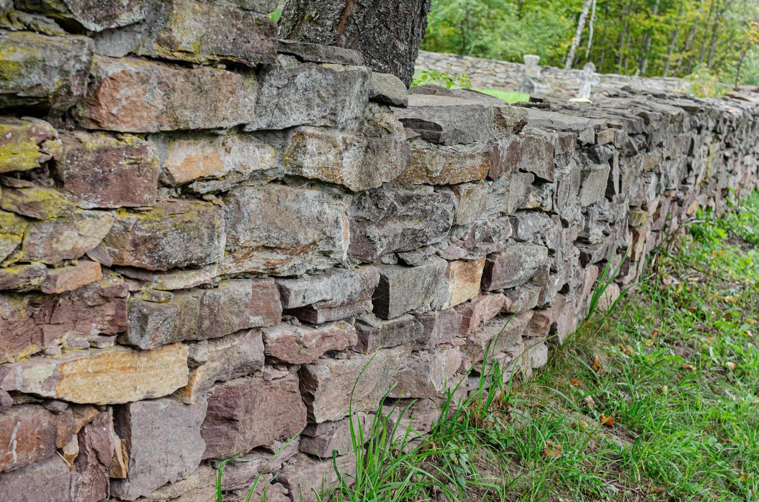 Old masonry of travertine at an angle to the observer photo