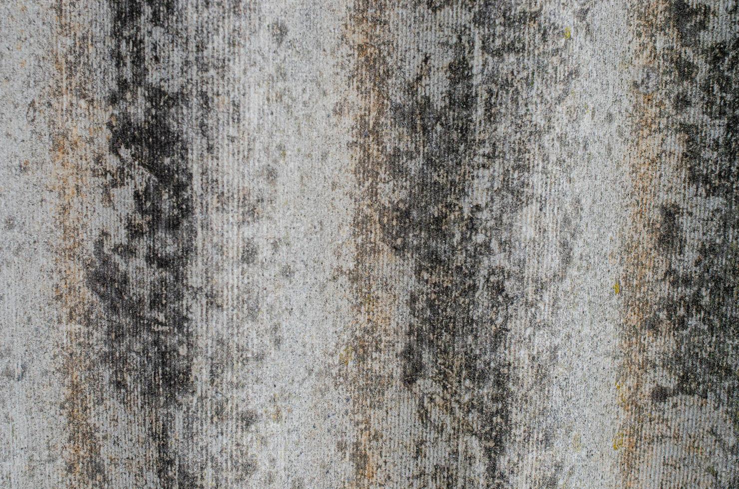 Gray wavy slate for the roof. Vertical view. Close-up. photo
