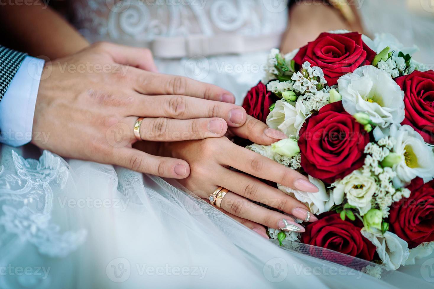 The bride holds a wedding bouquet in her hands, wedding day flowers. photo