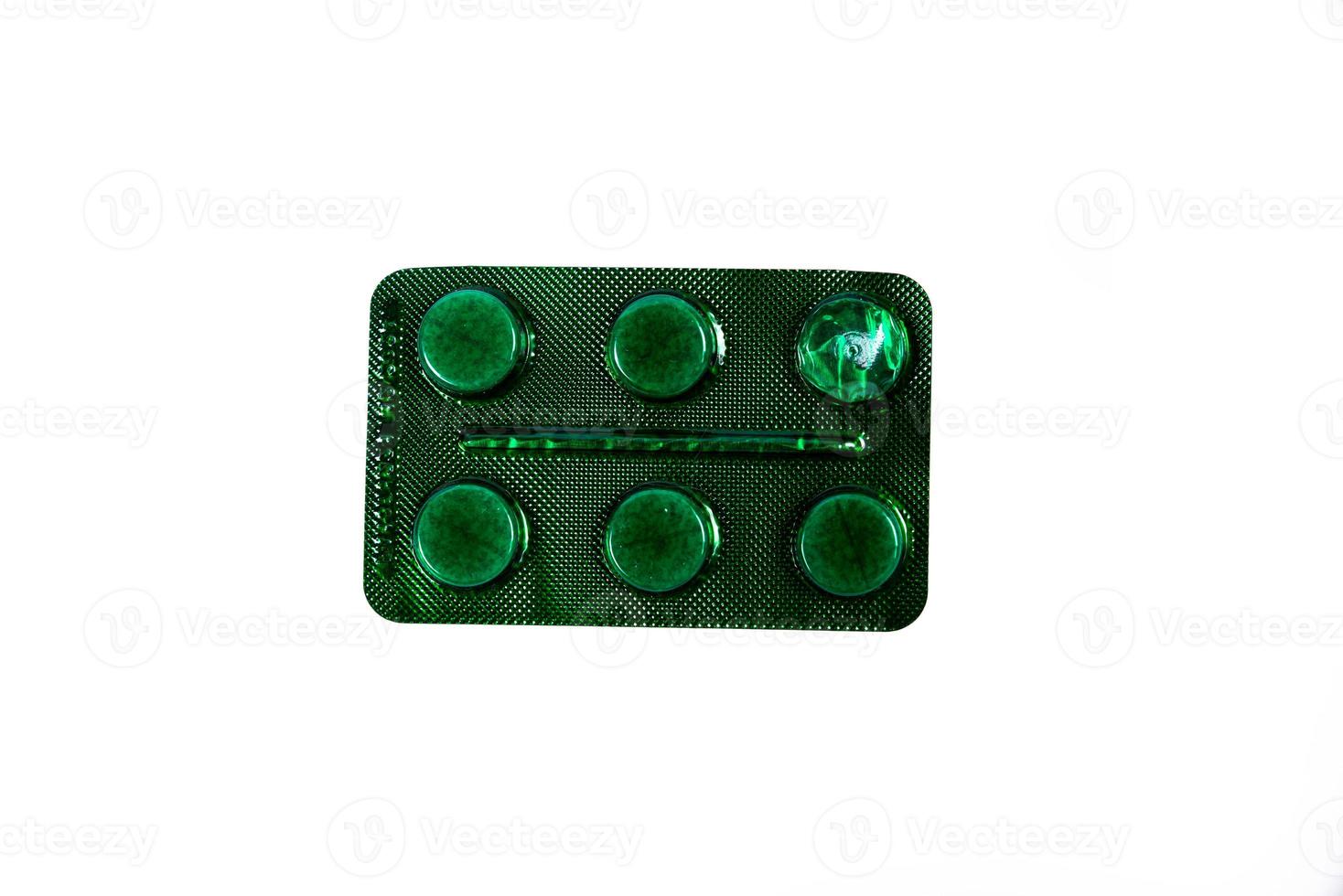 Medical pill blister on isolated white background with reflection photo