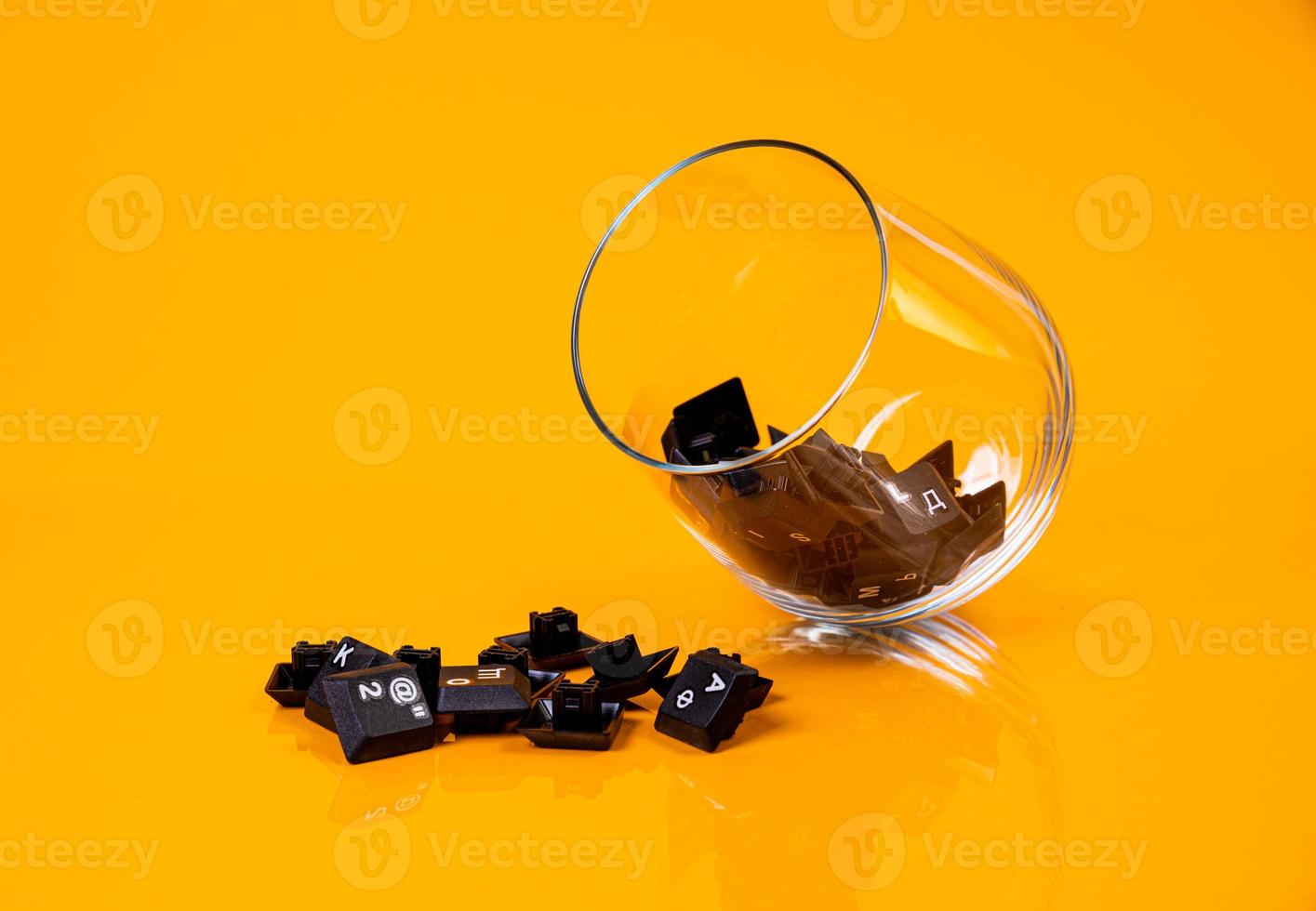 keyboard button in glass in jar in bucket on orange background photo