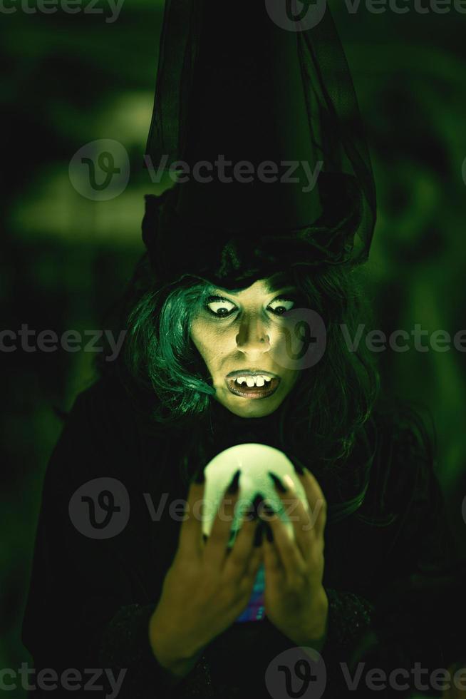 Magic Ball In Witch's Hands photo