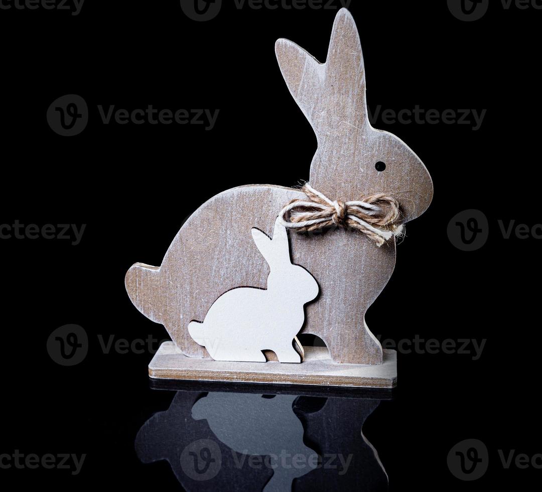 Beautiful wooden toy rabbit. Old hand-made souvenirs wooden toy rabbit photo