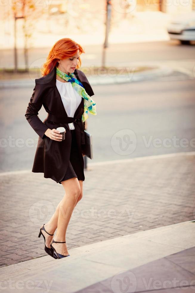 Succesfull Businesswoman On The Way In Building photo
