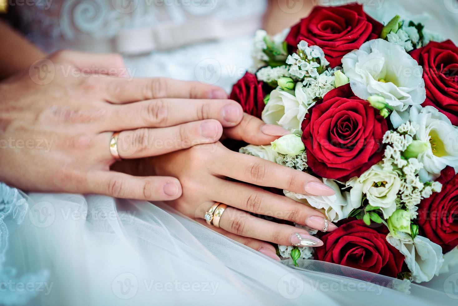 The bride holds a wedding bouquet in her hands, wedding day flowers. photo