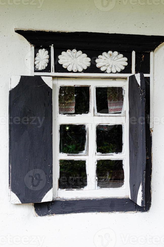 Window with wooden shutters photo