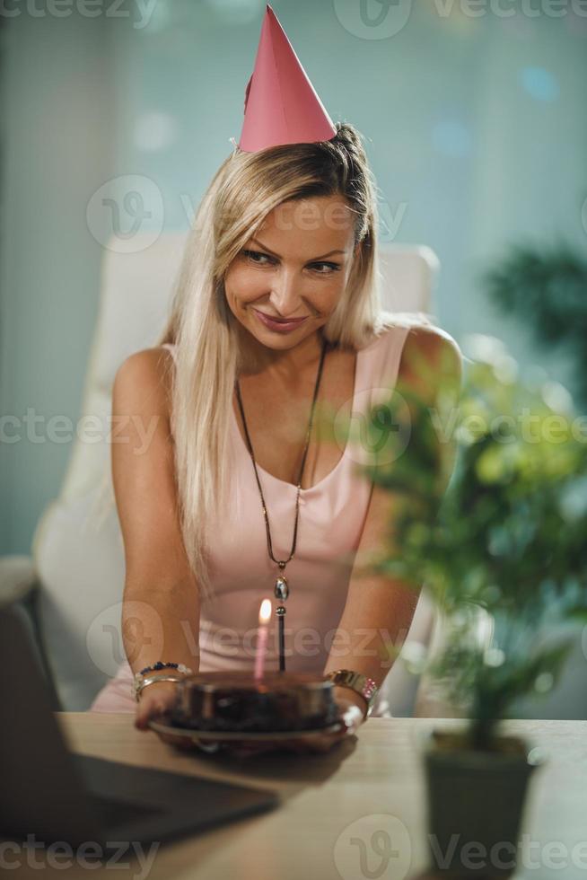 Woman Celebrating Birthday Alone At Home photo