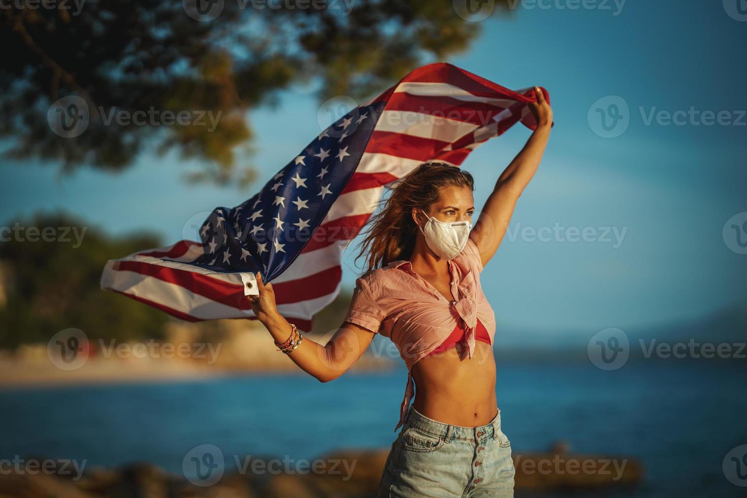 Young Woman With US National Flag During The Covid-19 photo