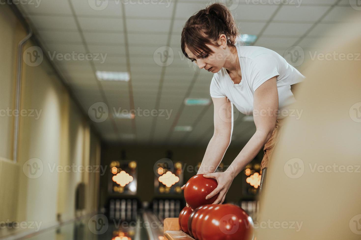 Young Woman Playing Bowling Nine Pin photo