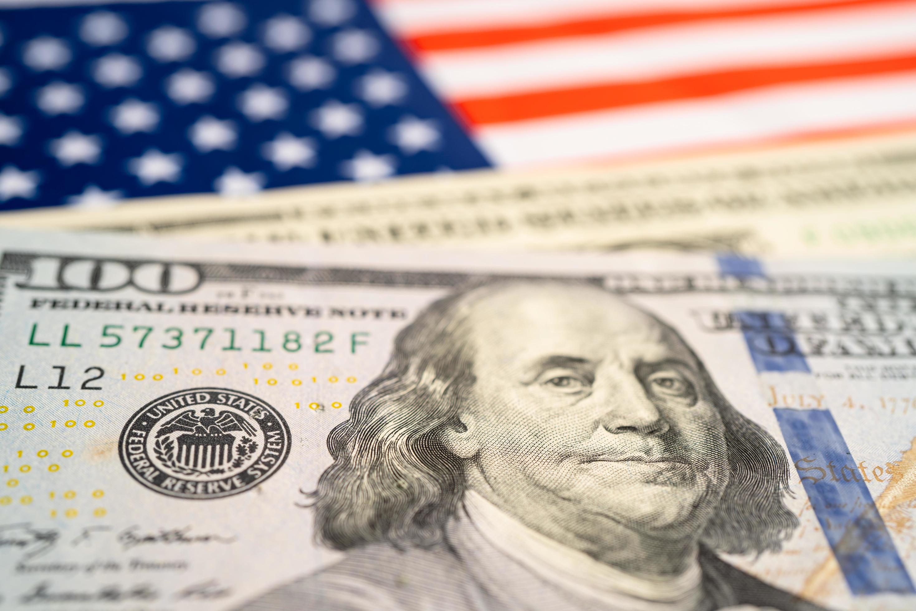 US Dollar Banknotes Money On USA America Flag Finance Banking Concept us-dollar-banknotes-money-on-usa-america-flag-finance-banking-concept