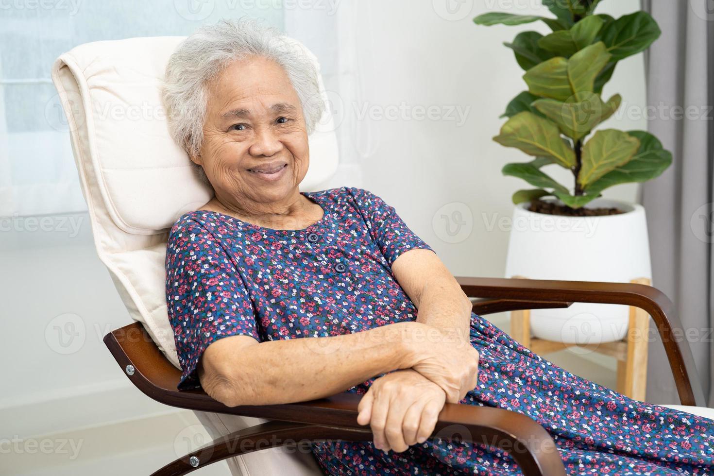 Asian elderly woman sitting and relaxing with happy in rocking chair at  room in home. 13882799 Stock Photo at Vecteezy