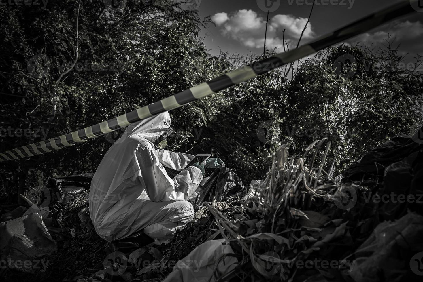 Asian scientist wear Chemical protection suit check danger chemical,working at dangerous zone photo