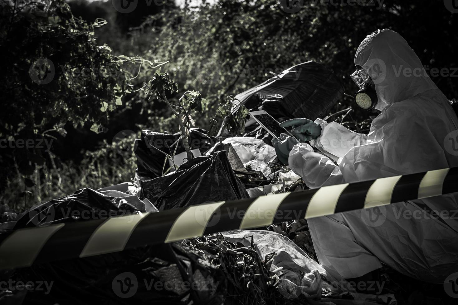Asian scientist wear Chemical protection suit check danger chemical,working at dangerous zone photo
