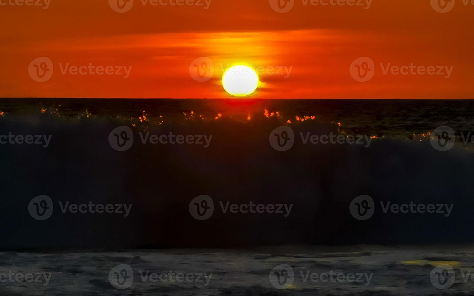 Colorful golden sunset big wave and beach Puerto Escondido Mexico. photo