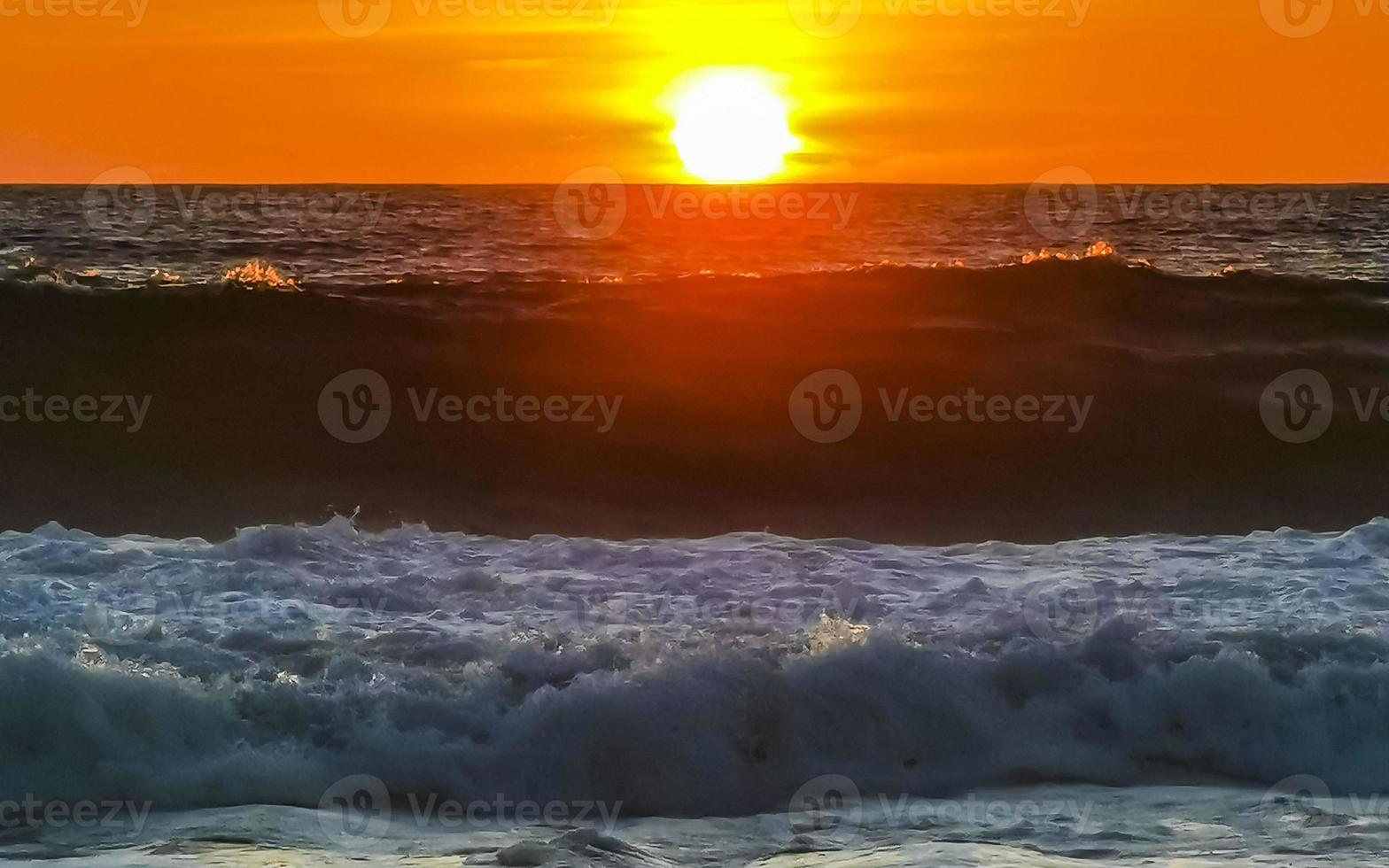 Colorful golden sunset big wave and beach Puerto Escondido Mexico. photo