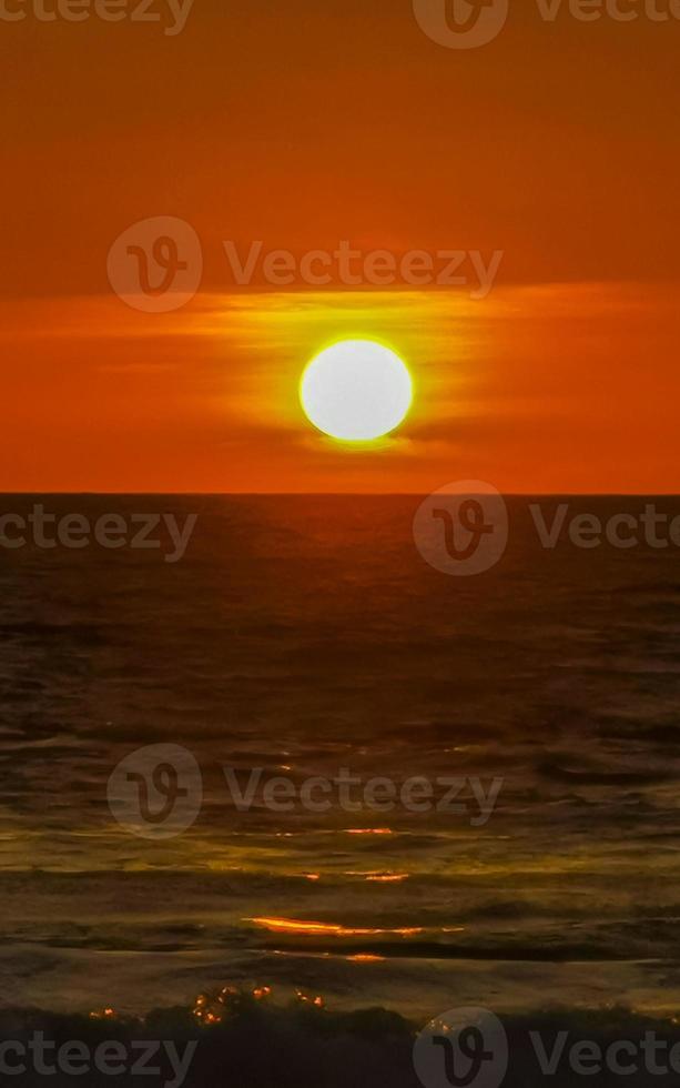 Colorful golden sunset big wave and beach Puerto Escondido Mexico. photo