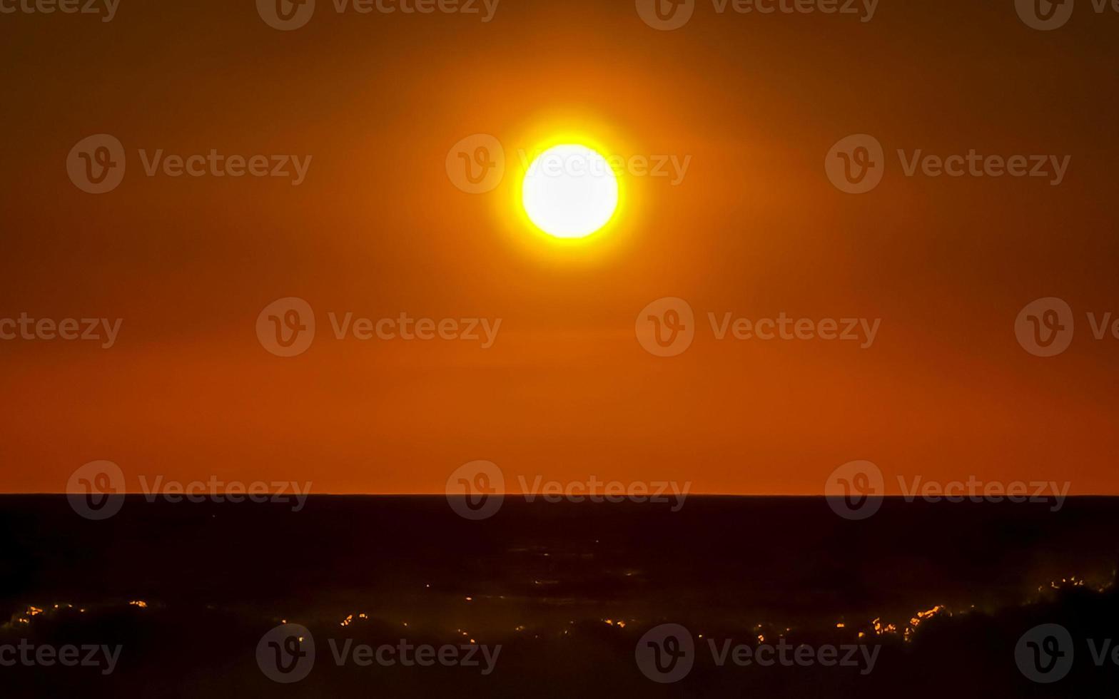 Colorful golden sunset big wave and beach Puerto Escondido Mexico. photo