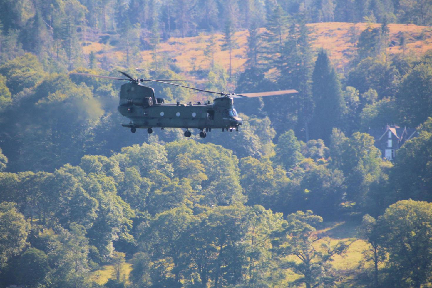 Windermere in the UK in 2022. A Helicopter flying over Lake Windermere photo