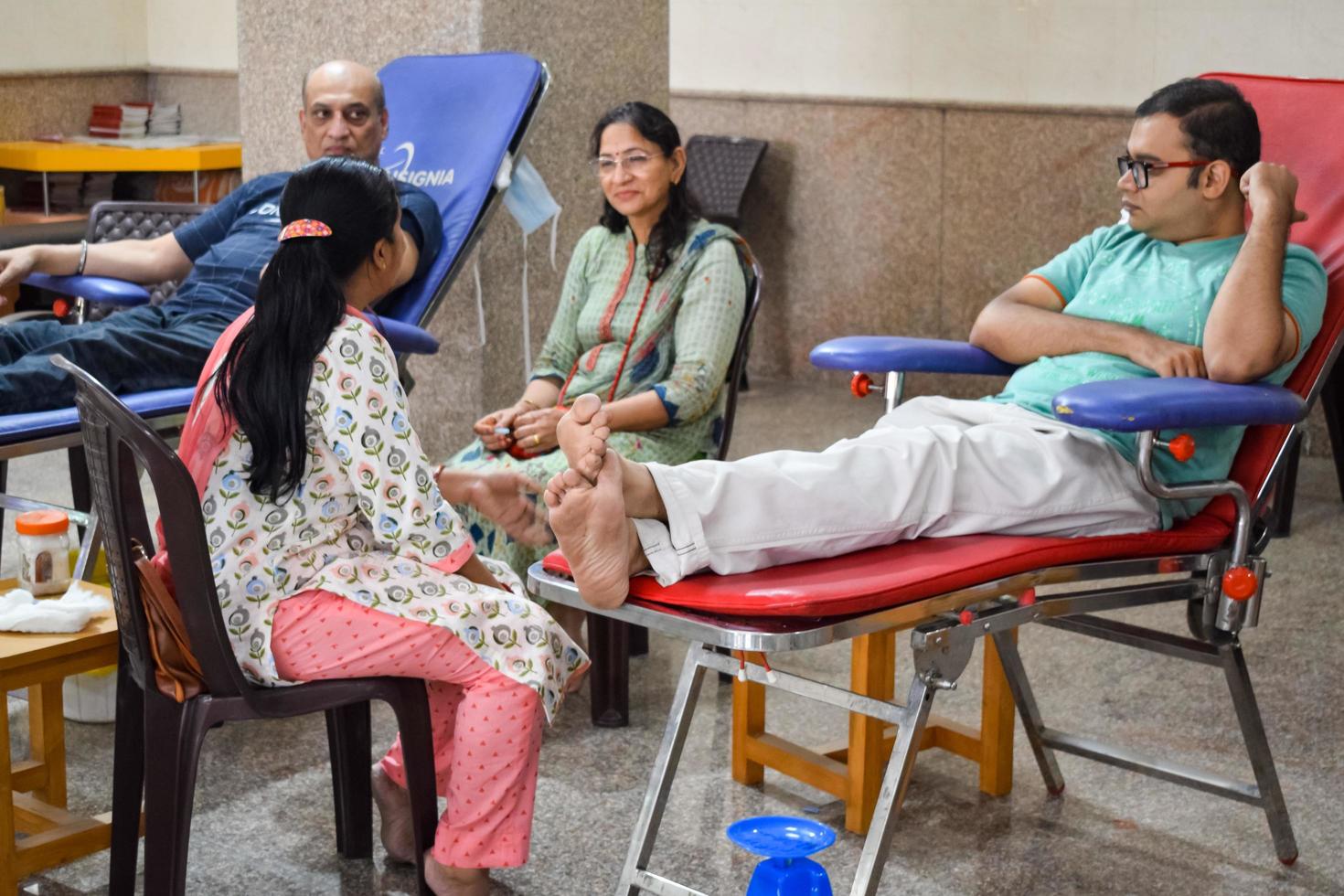 Delhi, India, June 19 2022 - Blood donor at Blood donation camp held at Balaji Temple, Vivek Vihar, Delhi, India, Image for World blood donor day on June 14 every year, Blood Donation Camp at Temple photo