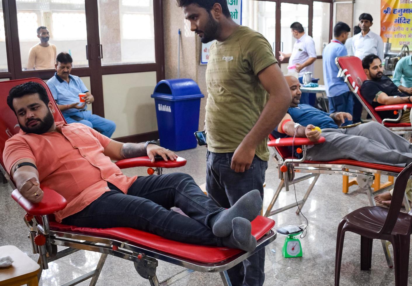 Delhi, India, June 19 2022 - Blood donor at Blood donation camp held at Balaji Temple, Vivek Vihar, Delhi, India, Image for World blood donor day on June 14 every year, Blood Donation Camp at Temple photo