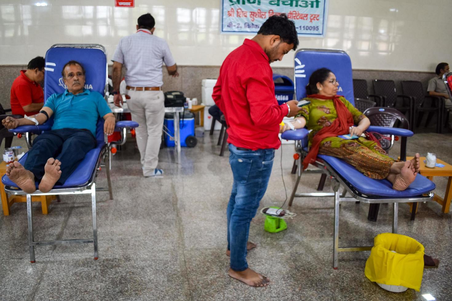 Delhi, India, June 19 2022 - Blood donor at Blood donation camp held at Balaji Temple, Vivek Vihar, Delhi, India, Image for World blood donor day on June 14 every year, Blood Donation Camp at Temple photo