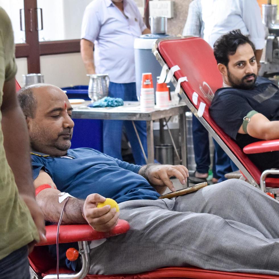 Delhi, India, June 19 2022 - Blood donor at Blood donation camp held at Balaji Temple, Vivek Vihar, Delhi, India, Image for World blood donor day on June 14 every year, Blood Donation Camp at Temple photo