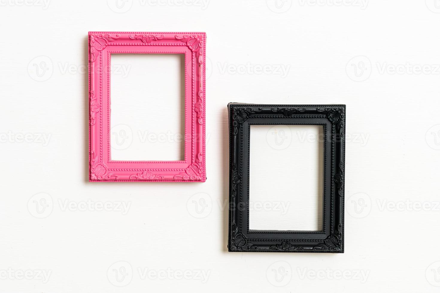 empty picture frame on white wall background photo