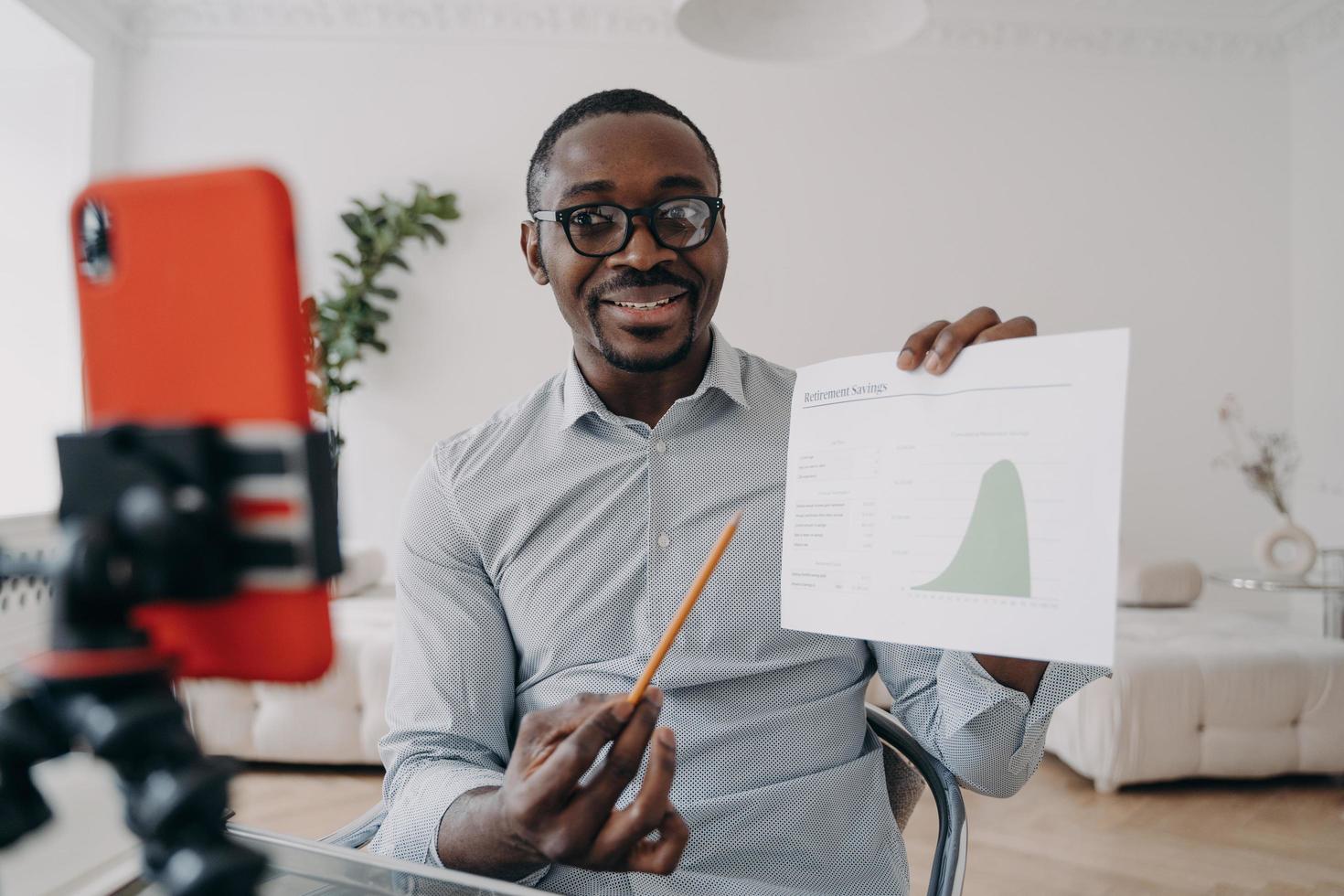 Businessman financial analyst shows statistics speaking on working conference by phone video call photo