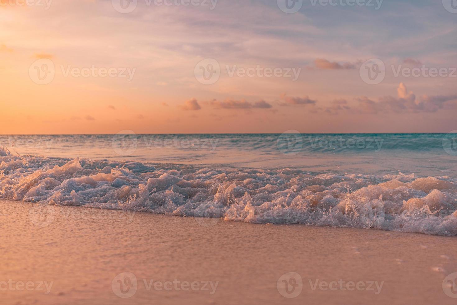 Beautiful sunrise beach. Exotic dramatic shore waves on sand, sea surface. Closeup tropical Mediterranean dream sunset sky. Peaceful tranquil relax summer colorful clouds. Positive energy meditation photo