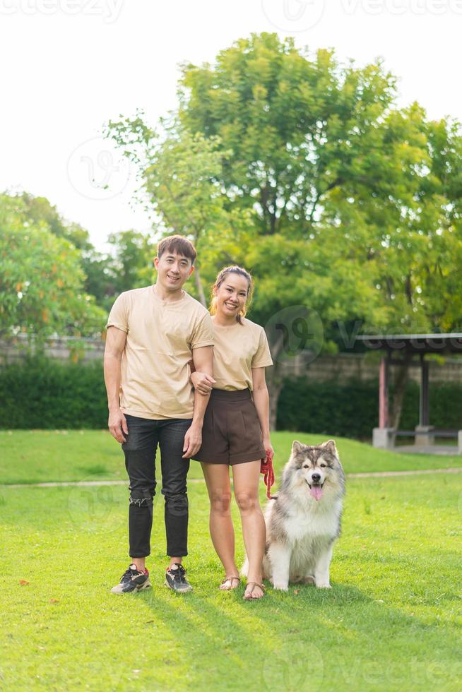 Asian couple love with dog photo