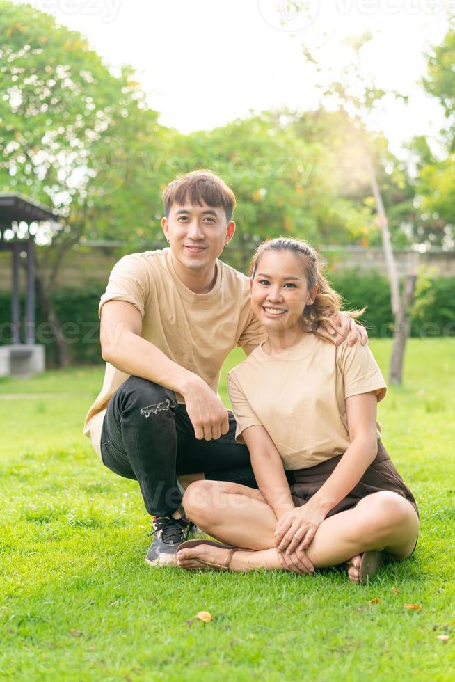 Asian couple love dating in park photo