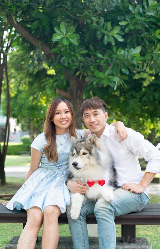 Asian couple love with dog photo