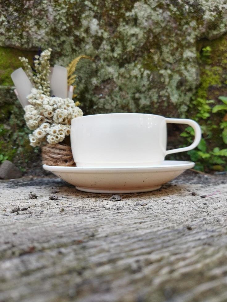 cup of tea with flowers decorations photo