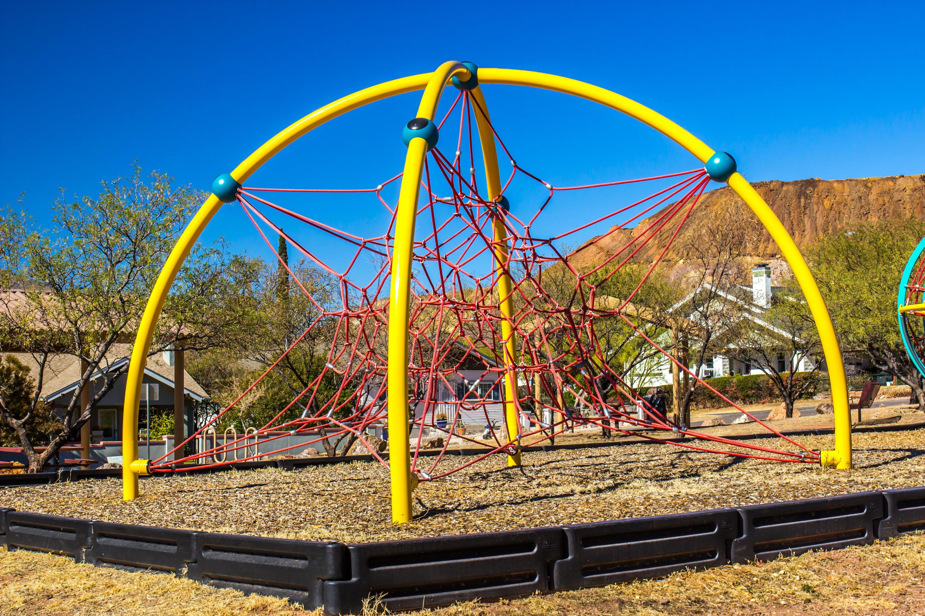 Spider Web Climbing Apparatus At Children’s Outdoor Playground 13899468