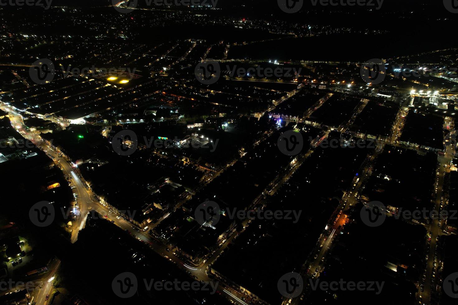 Beautiful Aerial View of British City and Roads at Night. Drone's High Angle Footage of Illuminated British Town photo