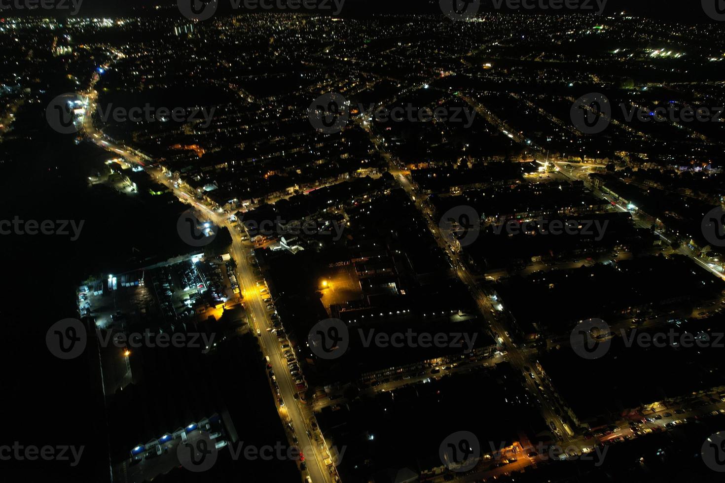 Beautiful Aerial View of British City and Roads at Night. Drone's High Angle Footage of Illuminated British Town photo